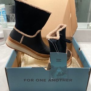 Tom’s snow/rain water resistant boots. Leather/suede. Brand new. Never worn